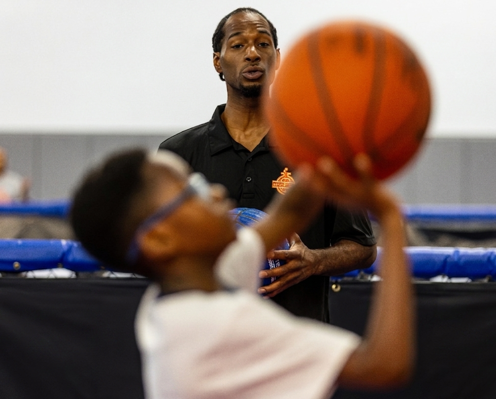 Hoop Lab coach guiding a player through shooting form