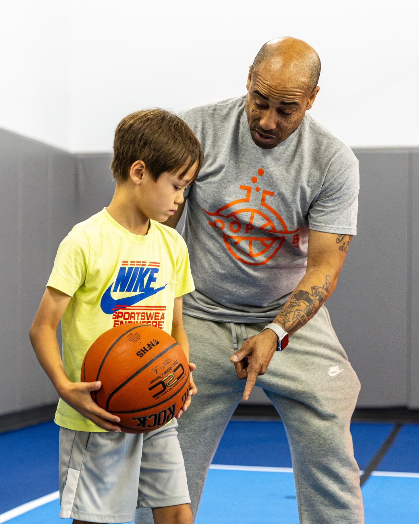 Hoop Lab coach working one-on-one with a young player